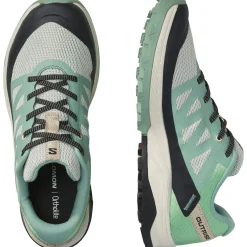 Salomon Vandresko|Fritidssko-Outrise Damesko Granite Green / Green Ash / Tender PeachVægt: 240 gramSalomon Outrise er en let allround outdoor sko til gåturene i naturen eller som praktisk og smart fritidssko.Skoens overdel er fremstillet i en let konstruktion med åndbar mesh, god beskyttelse og SensiFit™ påsvejset, der bidrager til en god pasform rund om foden, når skoen snørres.Fakta:- Fuze Foam EVA mellemsål bidrager til komfort i stødabsobering og skridtafviklingen- All Terrain Contragrip® undersål i slidstærkt gummi med et mønster, der giver fodfæste i både tørt, vådt, fast og løst underlag.          Detaljer